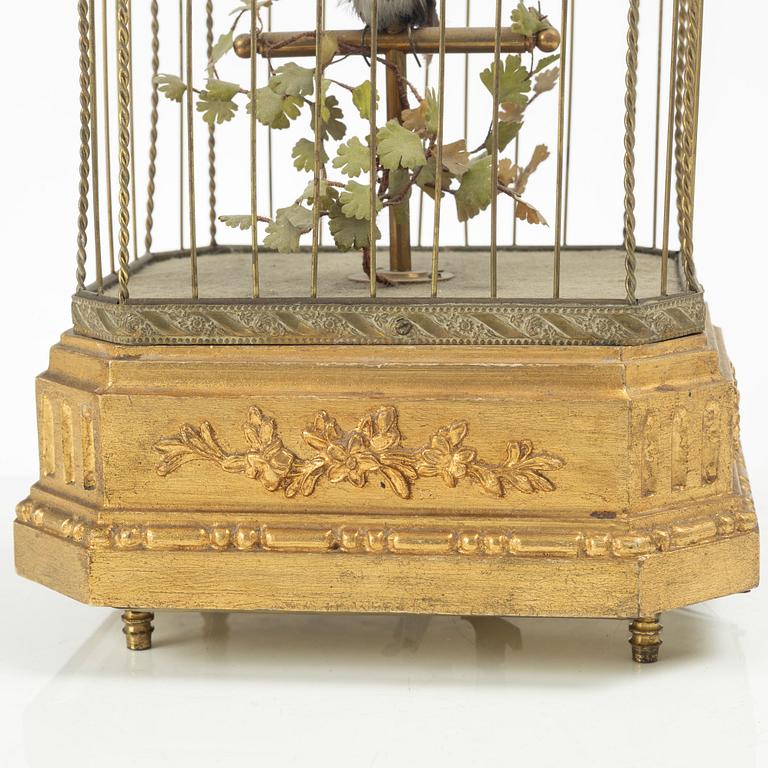 A music box in the shape of a bird's cage, France, late 19th century.