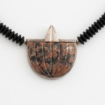Gaudy necklace, silver and carved stone.