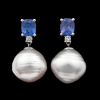 1091. A pair of tanzanite earrings, app. tot. 4 cts, diamonds app. tot. 0.16 ct. and cultured pearl.