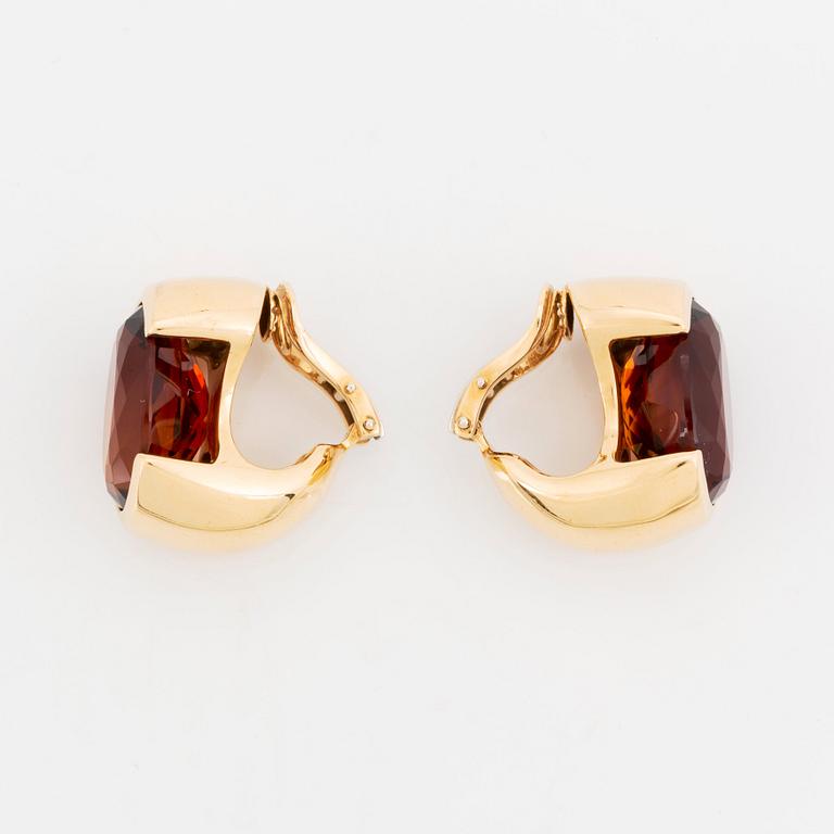 A pair of Tina Karlsson earrings in 18K gold set with faceted citrines.