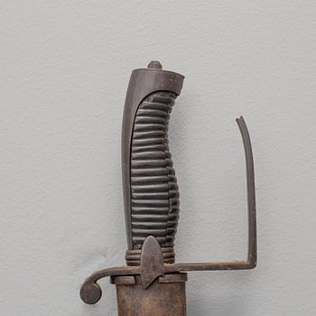 A british sabre with scabbard circa 1800.