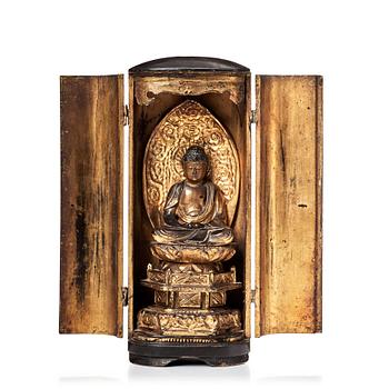 A Japanese buddha in a shrine, Edo period, 19th Century.