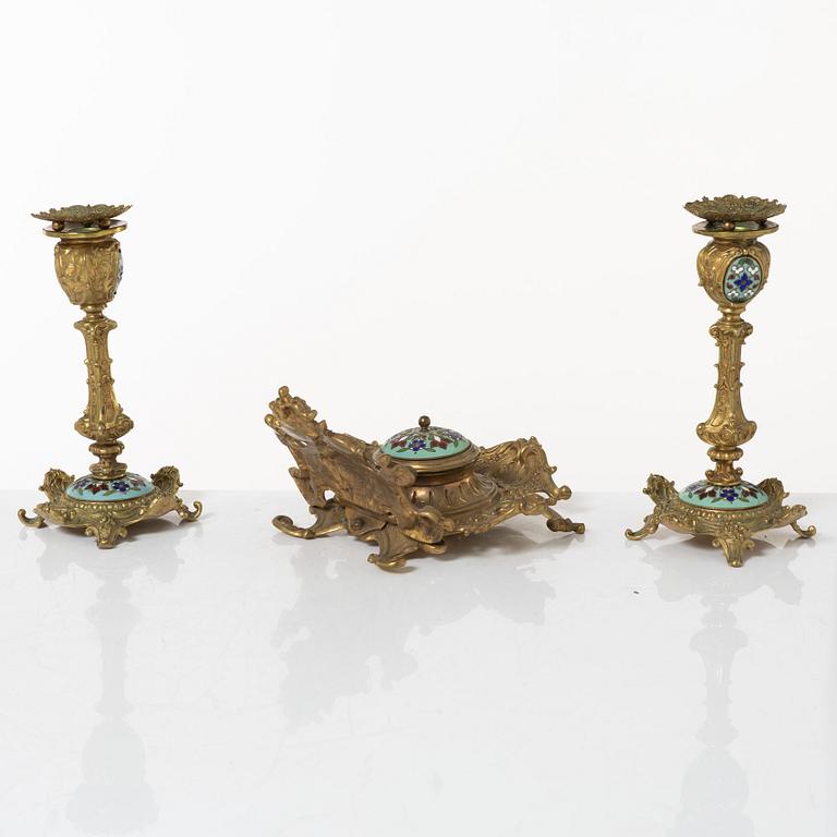 A pair candlesticks and an inkwell, circa 1900.