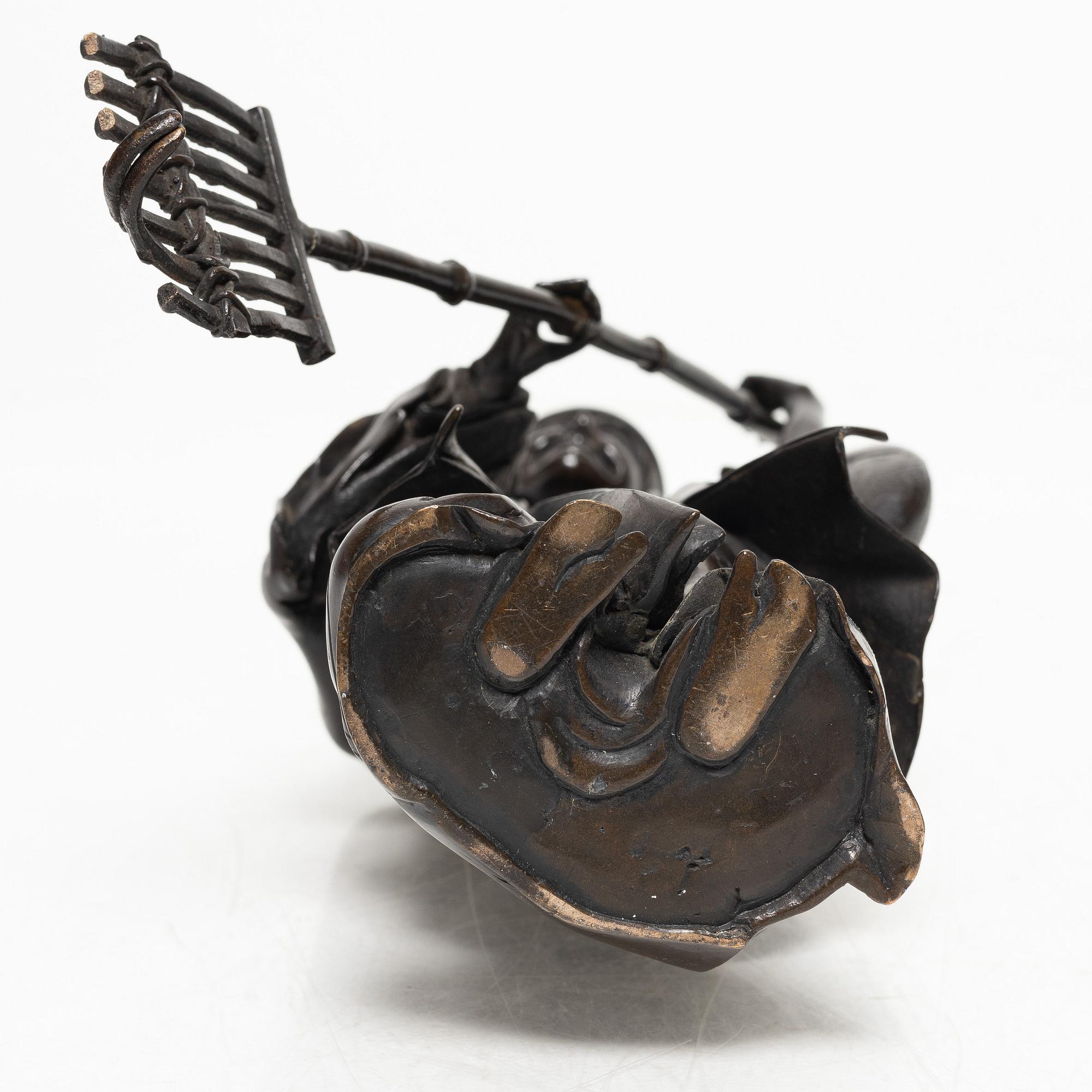 A Japanese bronze sculpture, of a gardener, Meiji period (1868-1912).
