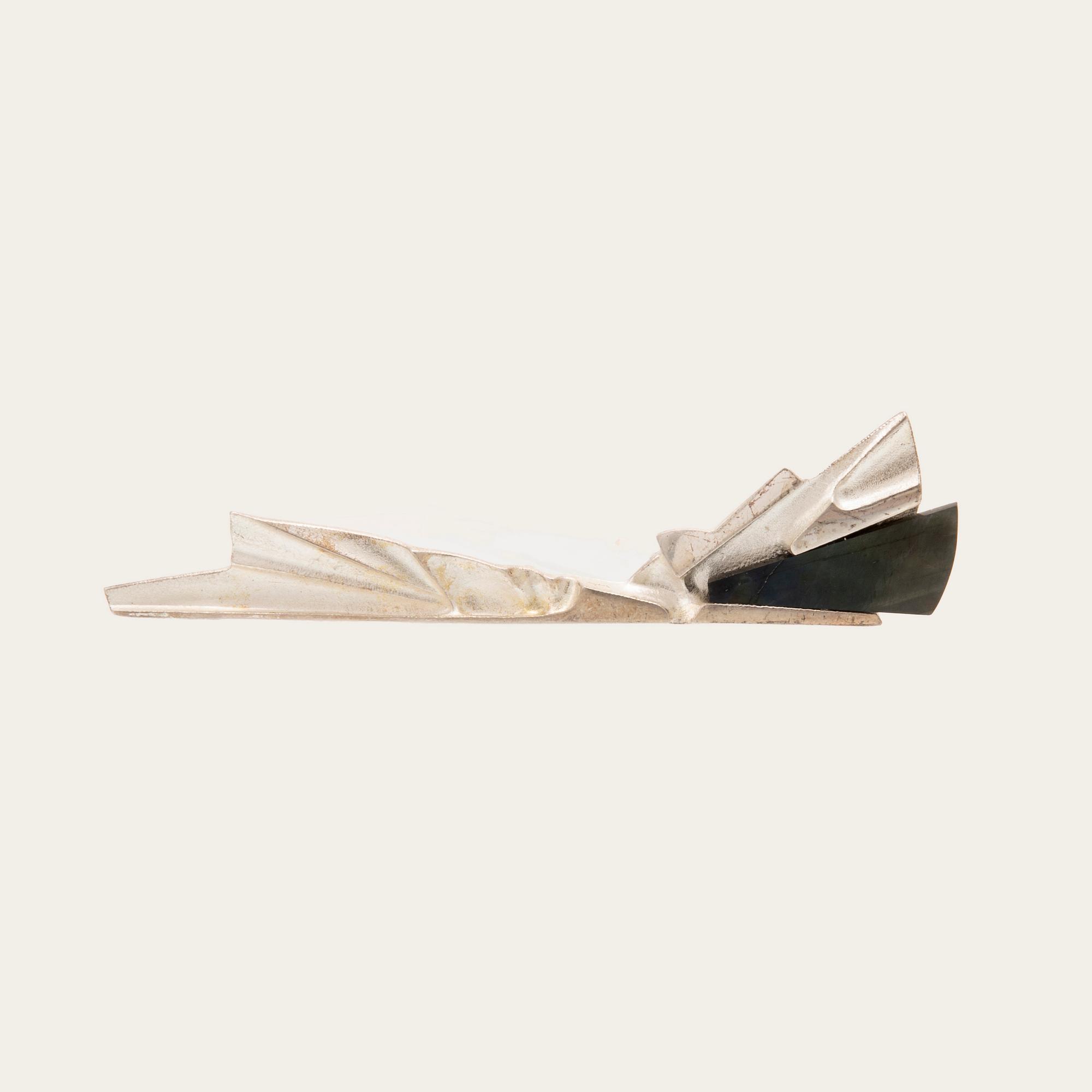 Zoltan Popovits, a "Railo" silver brooch set with spectrolite (variety of labradorite) for Lapponia 1991.