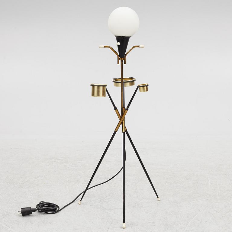 A 1950's floor lamp with ashtray and cigarette holder, Stilnovo.