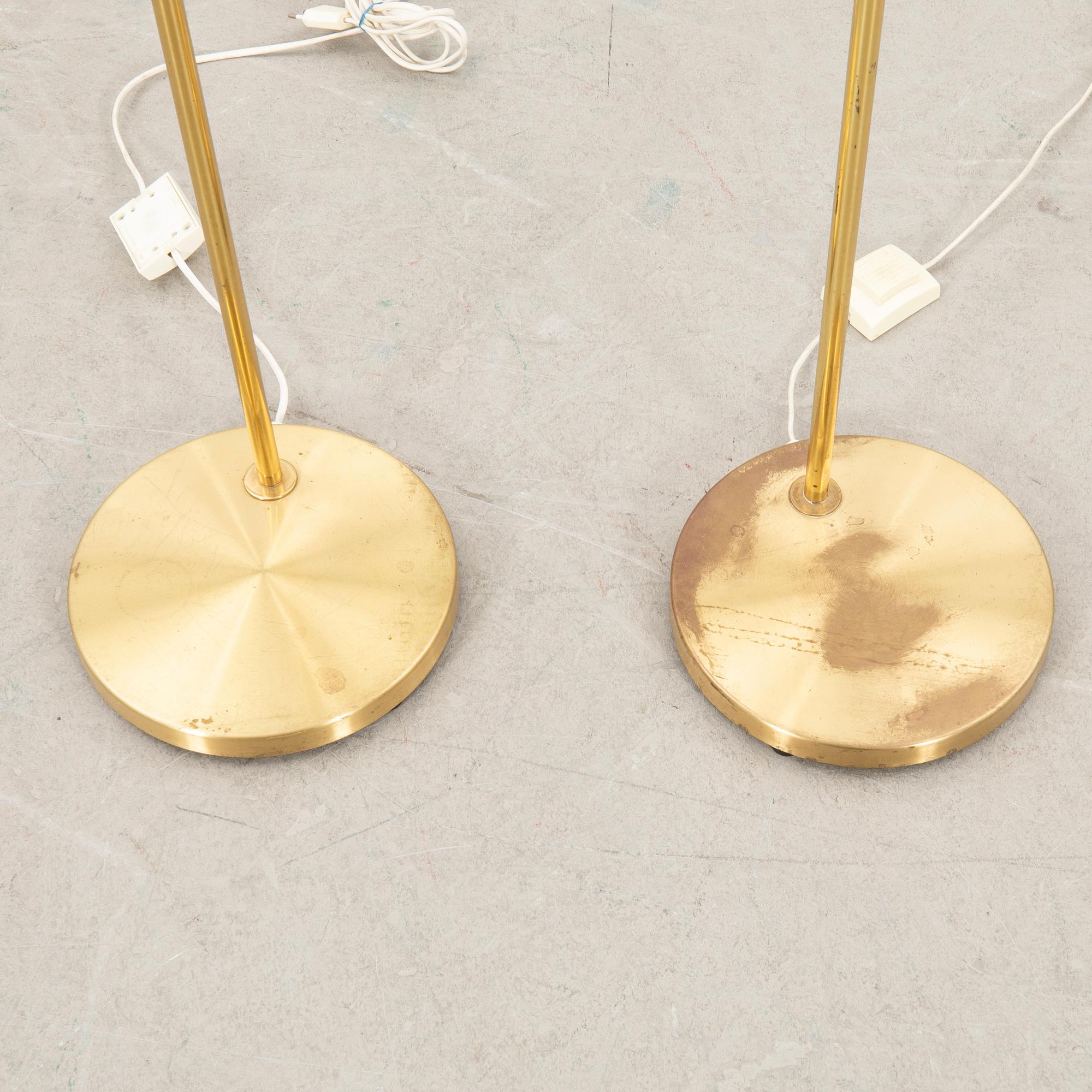 Floor lamps a pair Fixture craftsmanship late 20th century.