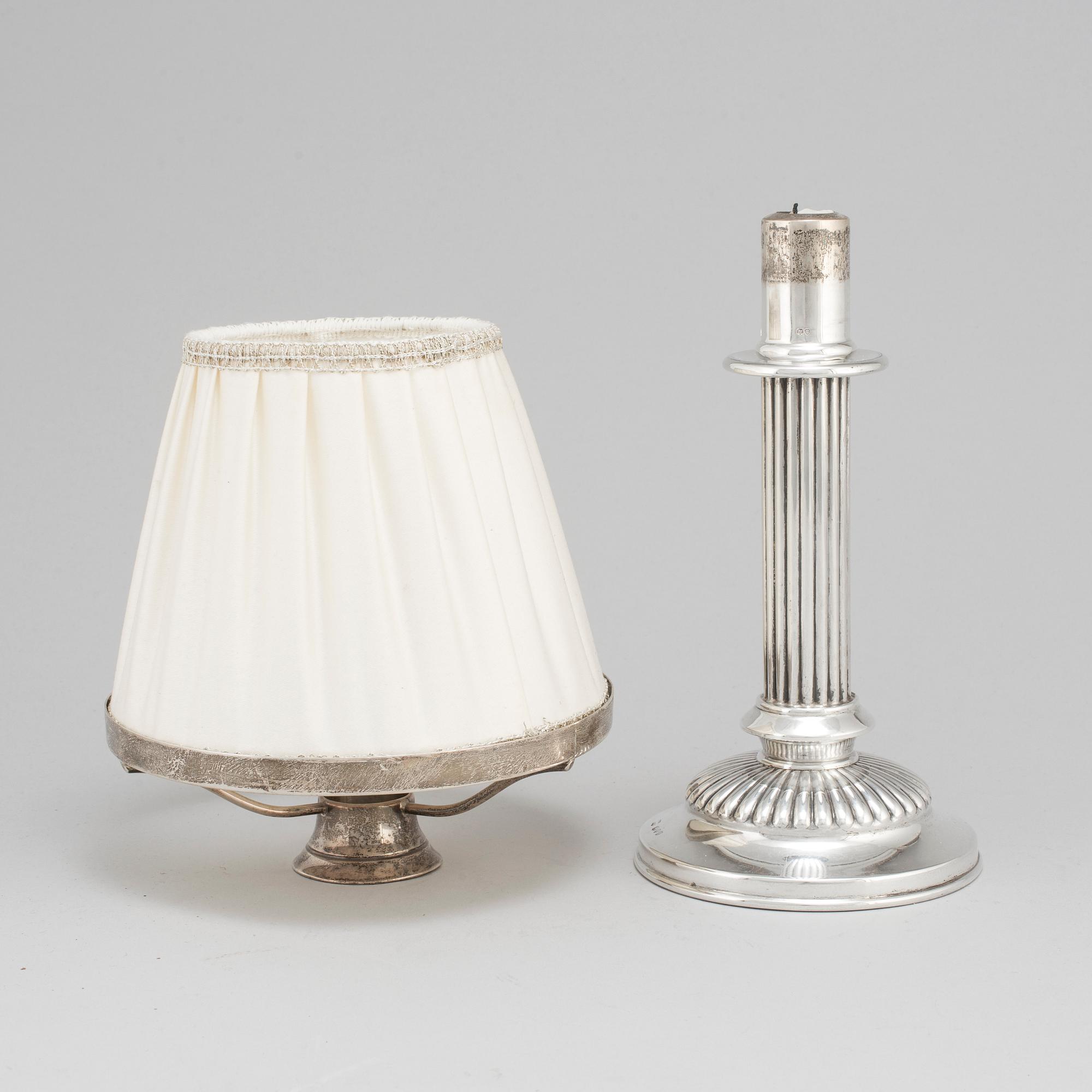 An English 19th century silver candlestick and shade, mark of London 1890.