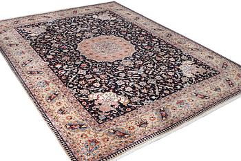 An old Tabriz carpet, c. 390 x 296 cm.