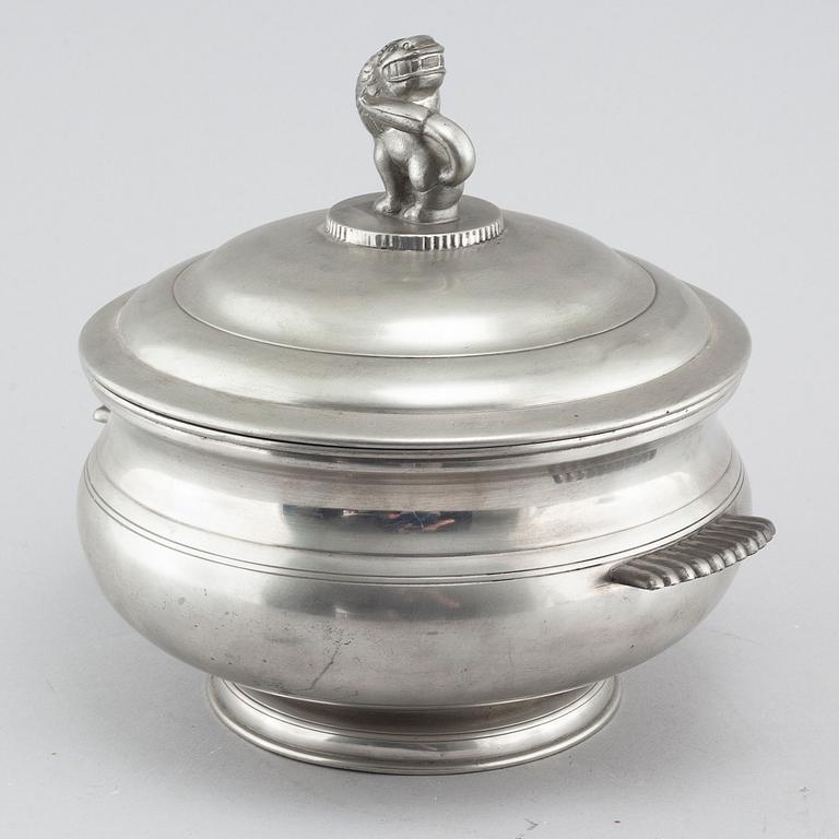 A lidded pewter terrine, model 277, Firma Svenskt tenn 1926. The lion probably designed by Anna Petrus.