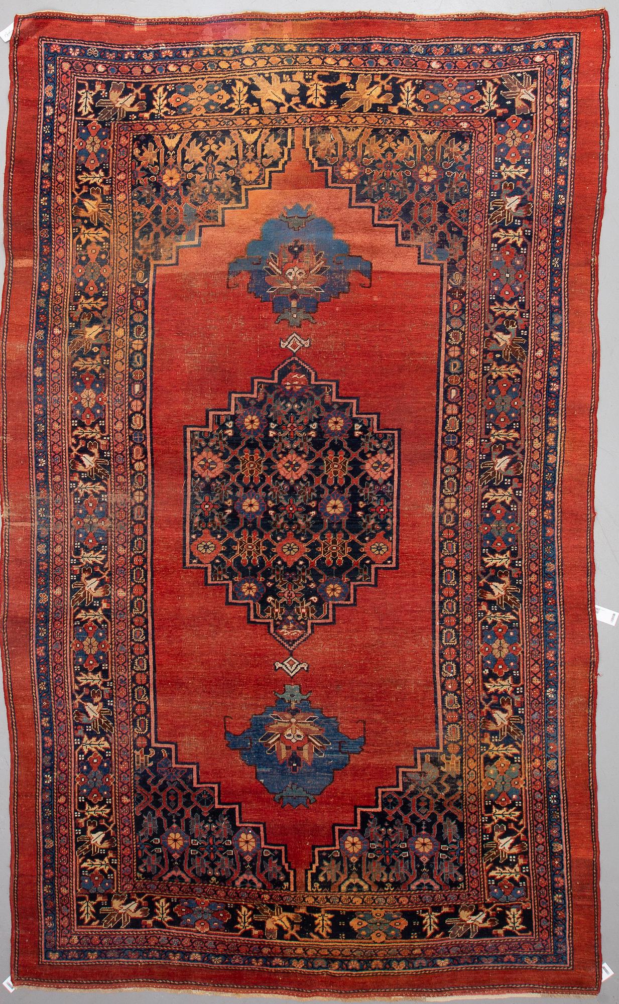 AN ANTIQUE BIDJAR CARPET, CA 374 X 224 CM.