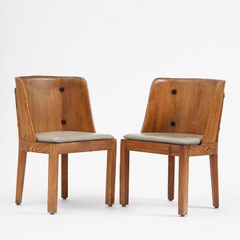 Axel Einar Hjorth, a pair of stained pine "Lovö" armchairs, Nordiska Kompaniet, Sweden, 1930s.