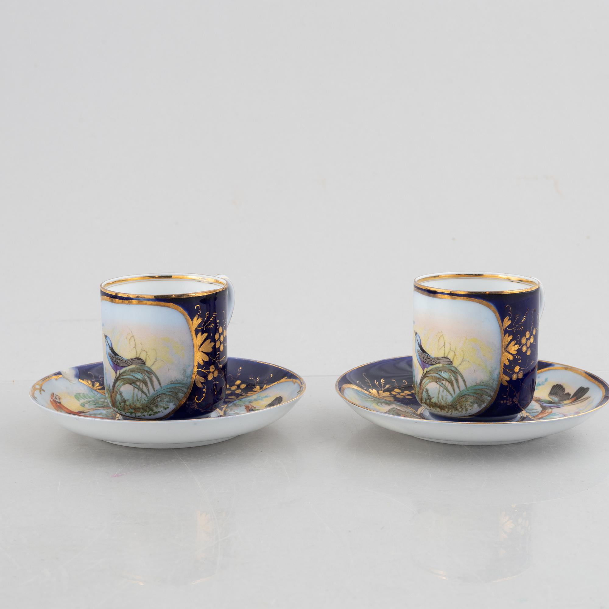 A set of nine porcelain coffee cups with saucers, Kuznetsov, Russia (1891-1917).