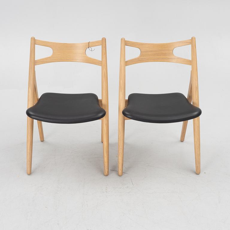 Hans J Wegner, a pair of chairs, model CH 29 "The Savbuk Chair", Carl Hansen.