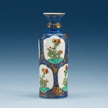 1447. A powder blue ground vase with gilding and 'famille-verte' enamels within reserves, Qing dynasty, Kangxi (1622-1722).