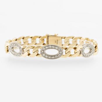 Arm bracelet, 14K gold with brilliant-cut diamonds.