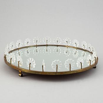 Estrid Ericson,  a mirror and brass table centrepiece from Svenskt Tenn.