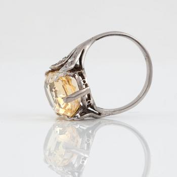 A yellow sapphire, circa 12.26 ct, ring.