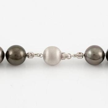 A necklace with cultured Tahitian pearls.