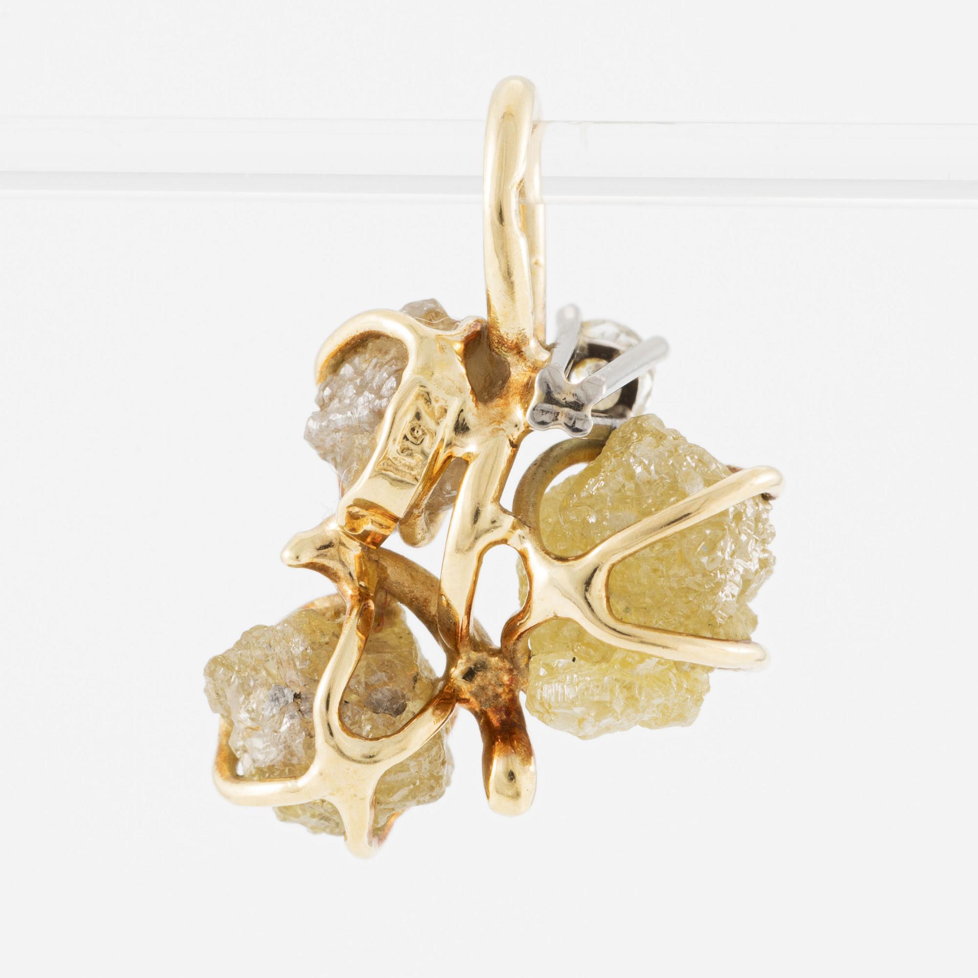 Pendant in 18K gold with rough diamonds and a round brilliant-cut diamond.