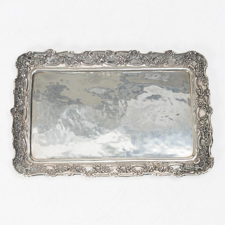 Two creamers, a tray, and a sugar tongs, silver, Rococo and Rococo style, 18th-19th century.