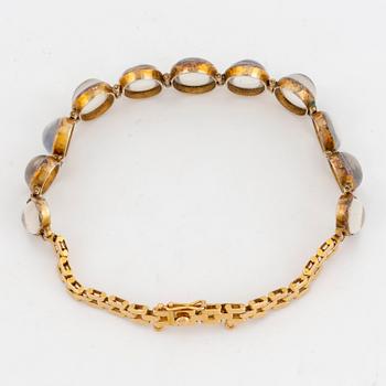 18K gold and cabochon-cut moonstone bracelet.