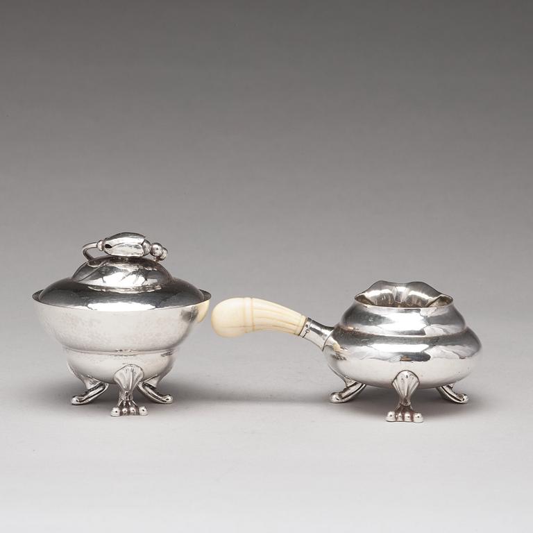 Georg Jensen, a "Blossom" sugarbowl and creamer, Copenhagen 1919-21, 830/1000 silver.