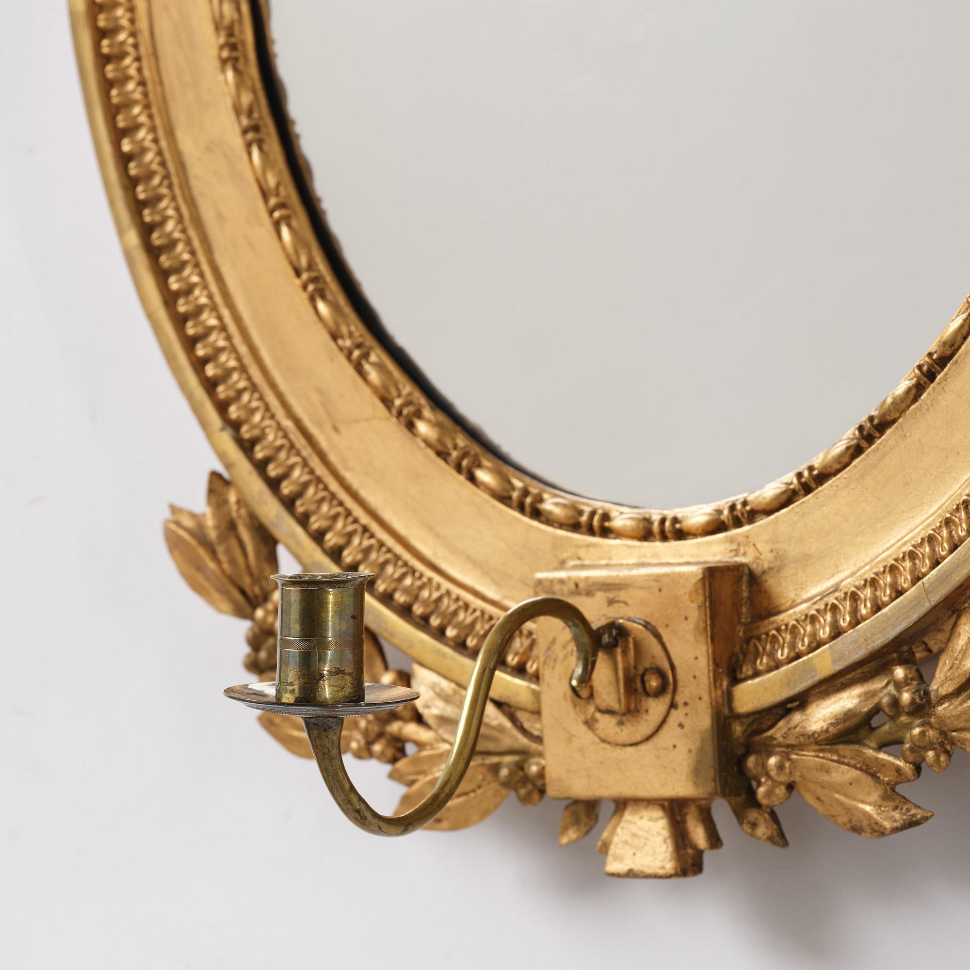 A pair of late Gustavian giltwood one light girandoles, Stockholm, circa 1800.