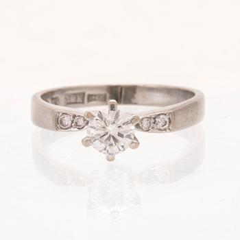 An 18K white gold ring set with round brilliant cut diamonds by Lundberg Guldatelje Amie Stockholm 1977.