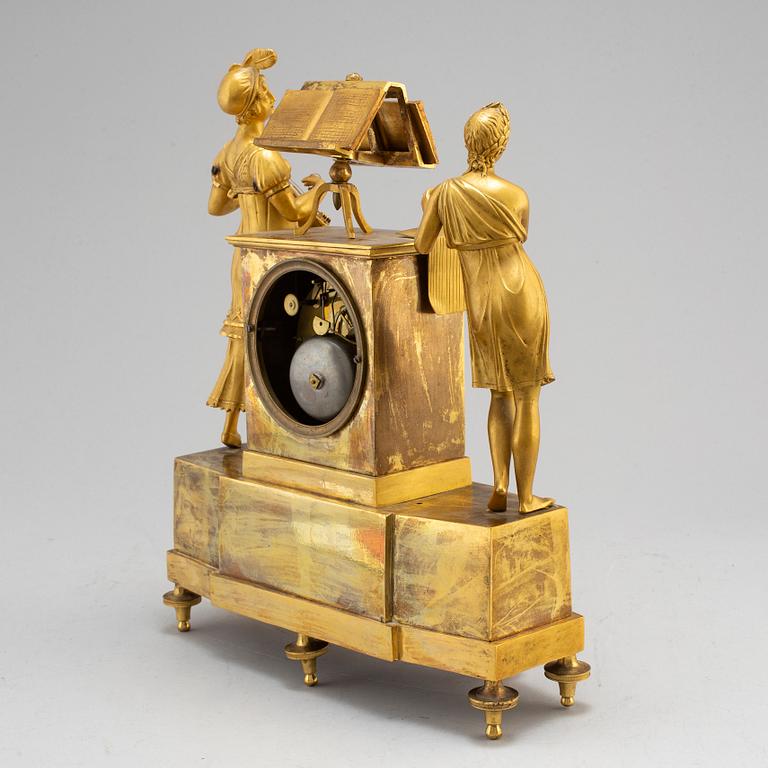 A French Empire gilt bronze mantel clock, first half of the 19th century.