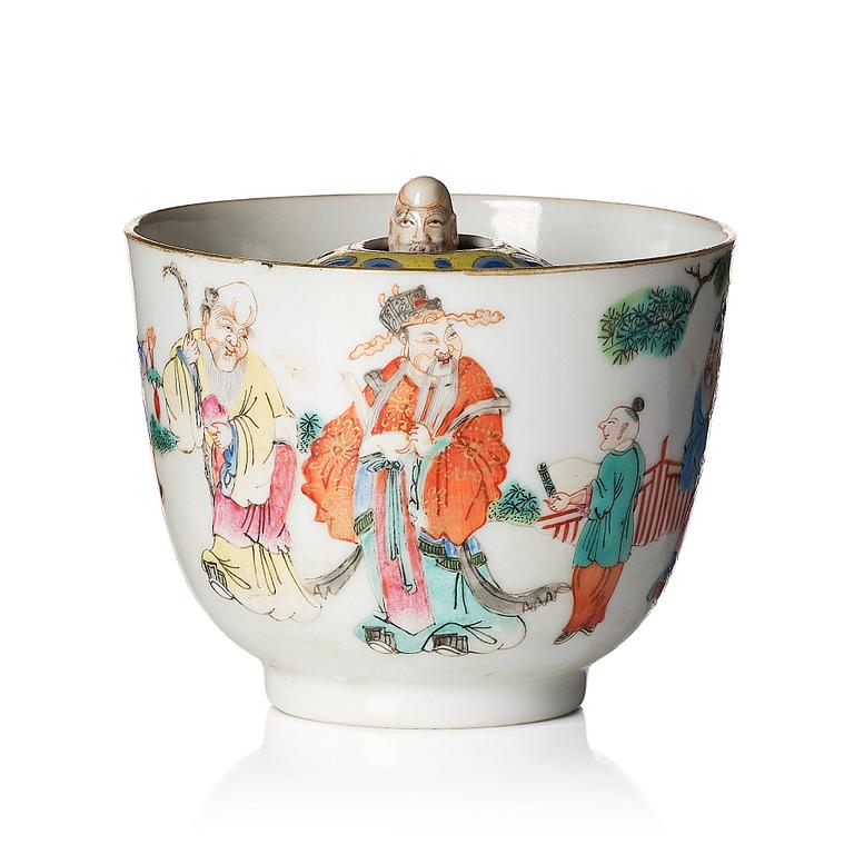 A famille rose 'trick cup' with a little figure, Qing dynasty, 19th Century.
