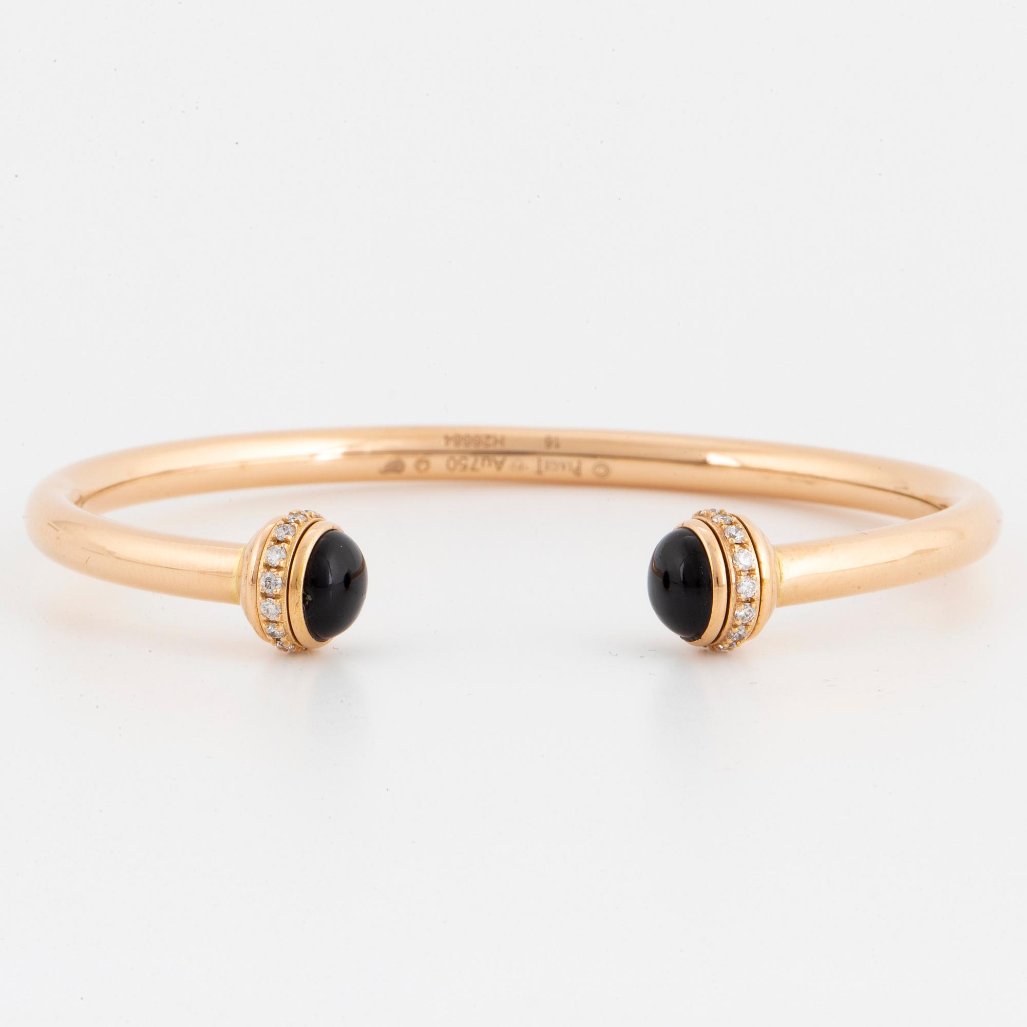 Piaget 18K rose gold, brilliant-cut diamonds and onyx cabochons.