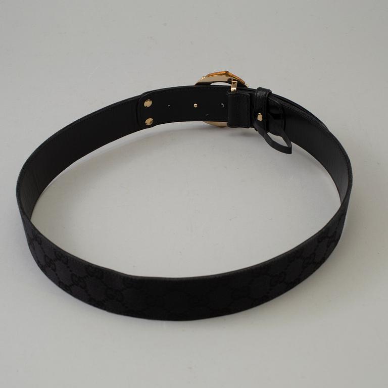 GUCCI, a leather and canvas belt, size 80/32.