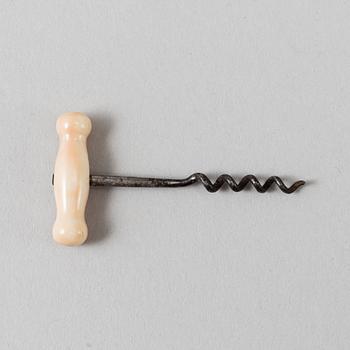 A 19th century bone and steel miniature corkscrew.