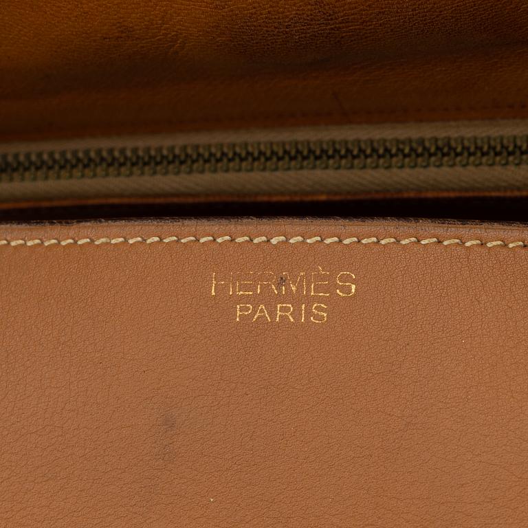 Hermès, a vintage tan leather bag, mid 20th century.