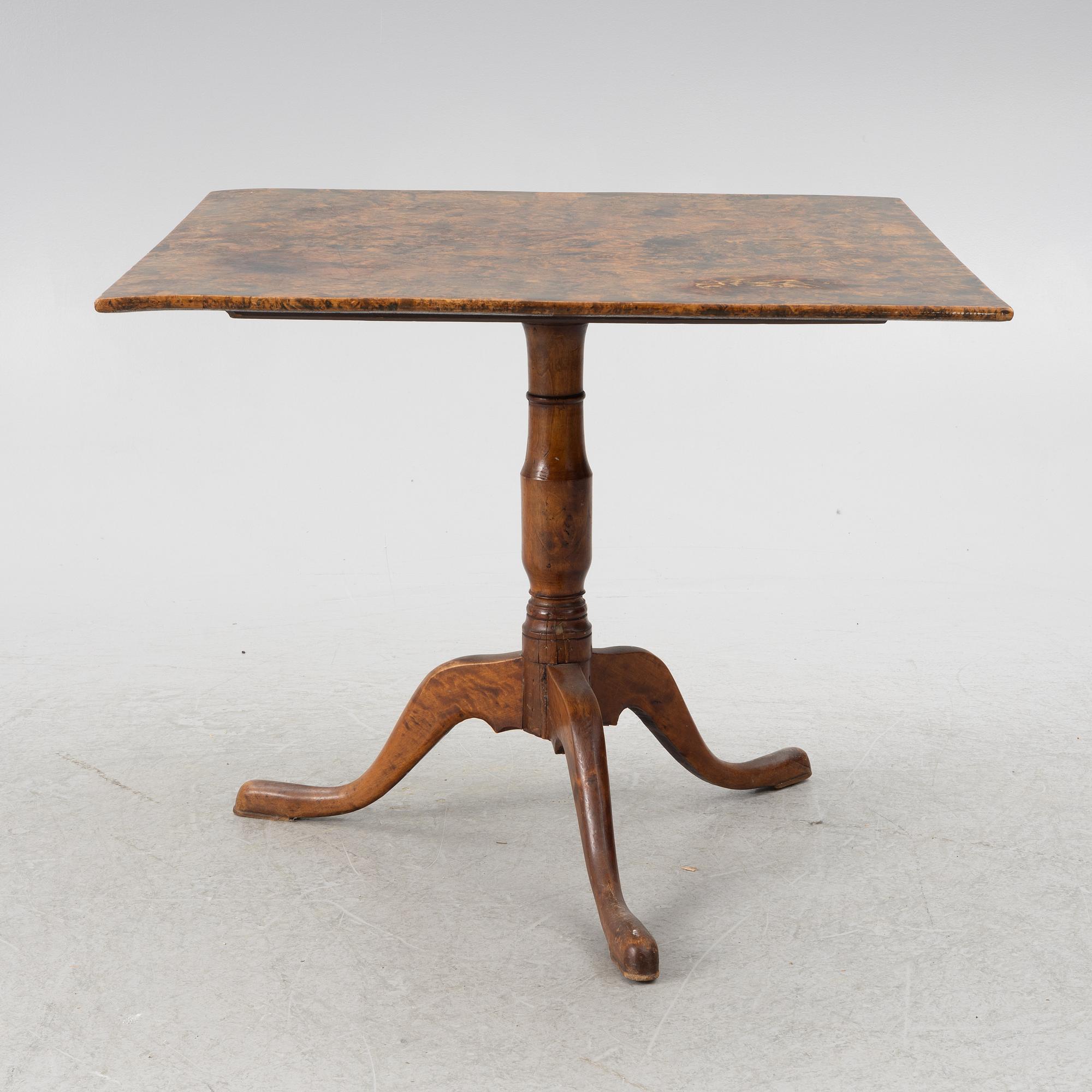 A drop-leaf table, circa 1800.