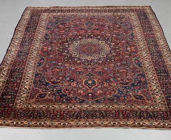 A carpet, semi-antique Mashad/Moud, ca 292 x 214 -218 cm.