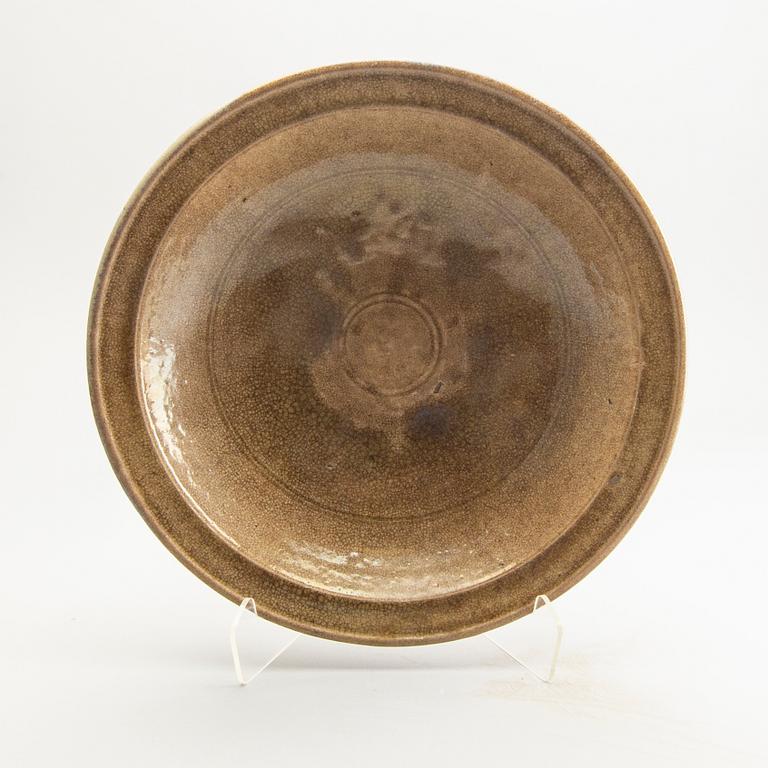 A celadon ge glazed dish, South East Asia, presumably Sawankhalok, 15th/17th Centuyr.