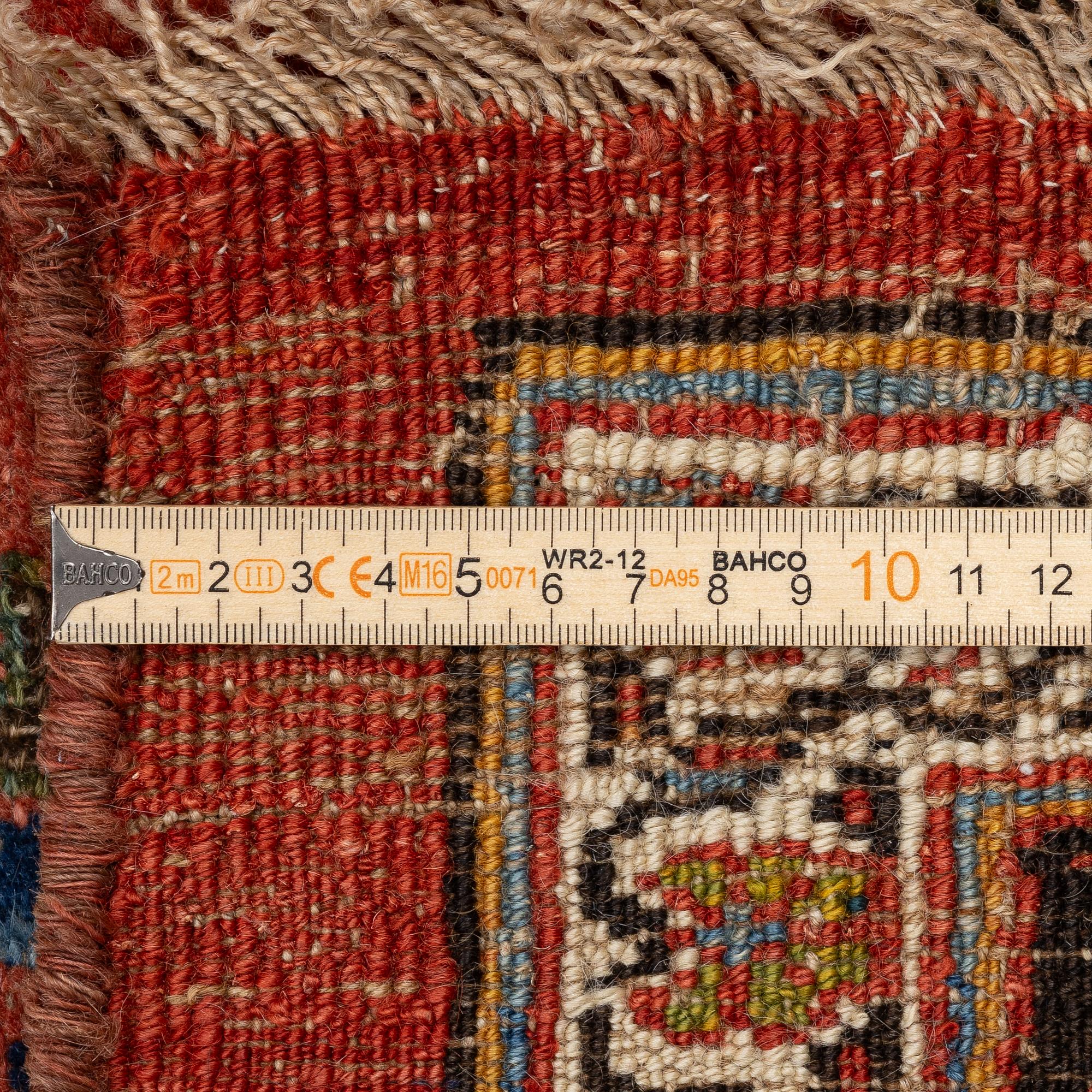 An antique Bidjar carpet, West Persia, c. 380 x 174 cm.
