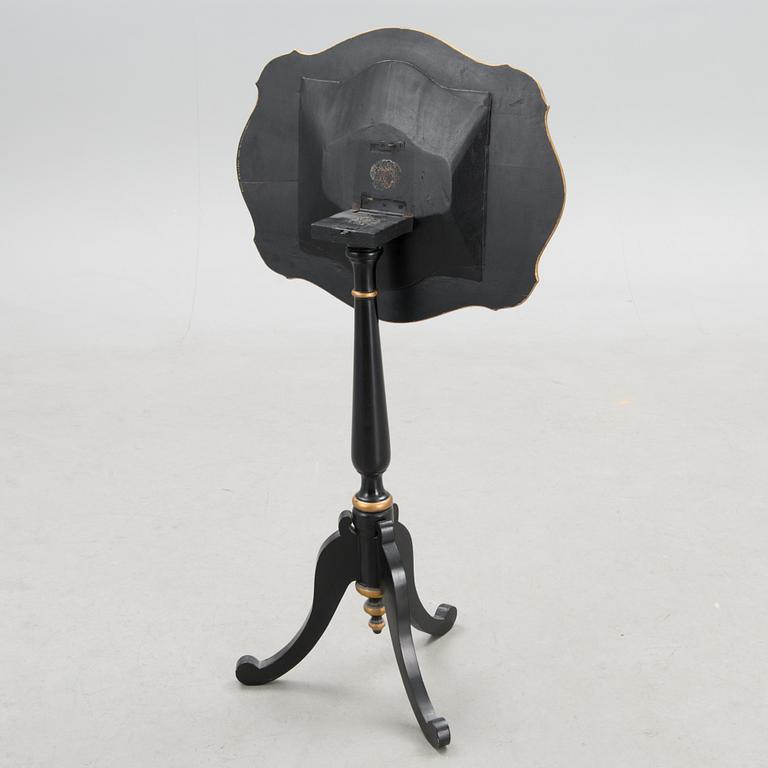 A Chinese tilt top chess table from the first half of the 20th century.
