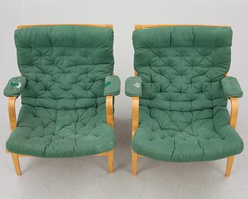 Bruno Mathsson, a pair of "Ingrid" armchairs, Dux, Sweden, second half of the 20th century.