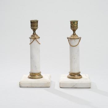 A PAIR OF CANDLESTICKS, brass and marble, gustavian late 18th century.