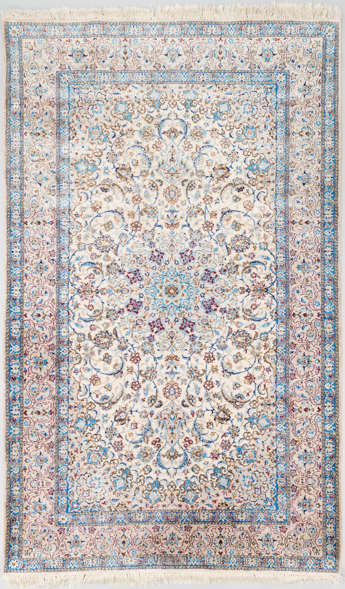 A oriental signed Nain silk carpet. Circa 267x163 cm.
