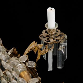 An Oscarian gilt brass eight-light chandelier.