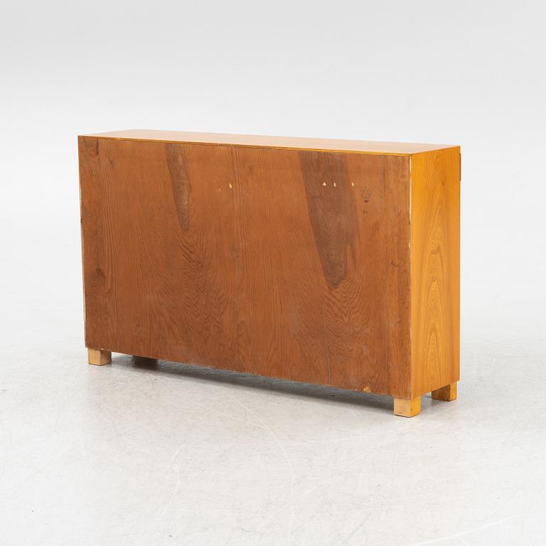 An elmwood-veneered bookcase, Nilsson & Johansson Möbelfabrik, Björnum, mid 20th century.