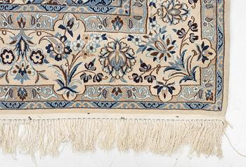 A Nain carpet, signed, c. 315 x 200 cm.