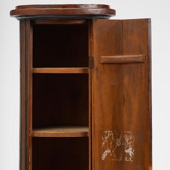 A Swedish Empire column-shaped cabinet, first part 19th century.