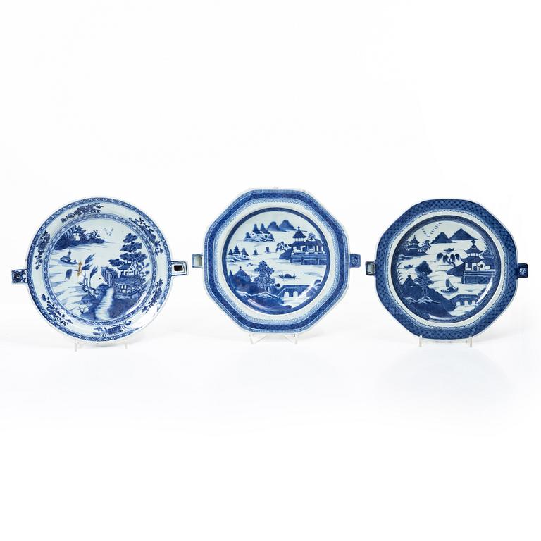 A group of three Chinese blue and white porcelain hot water dishes, Qing dynasty, 18/19th century.