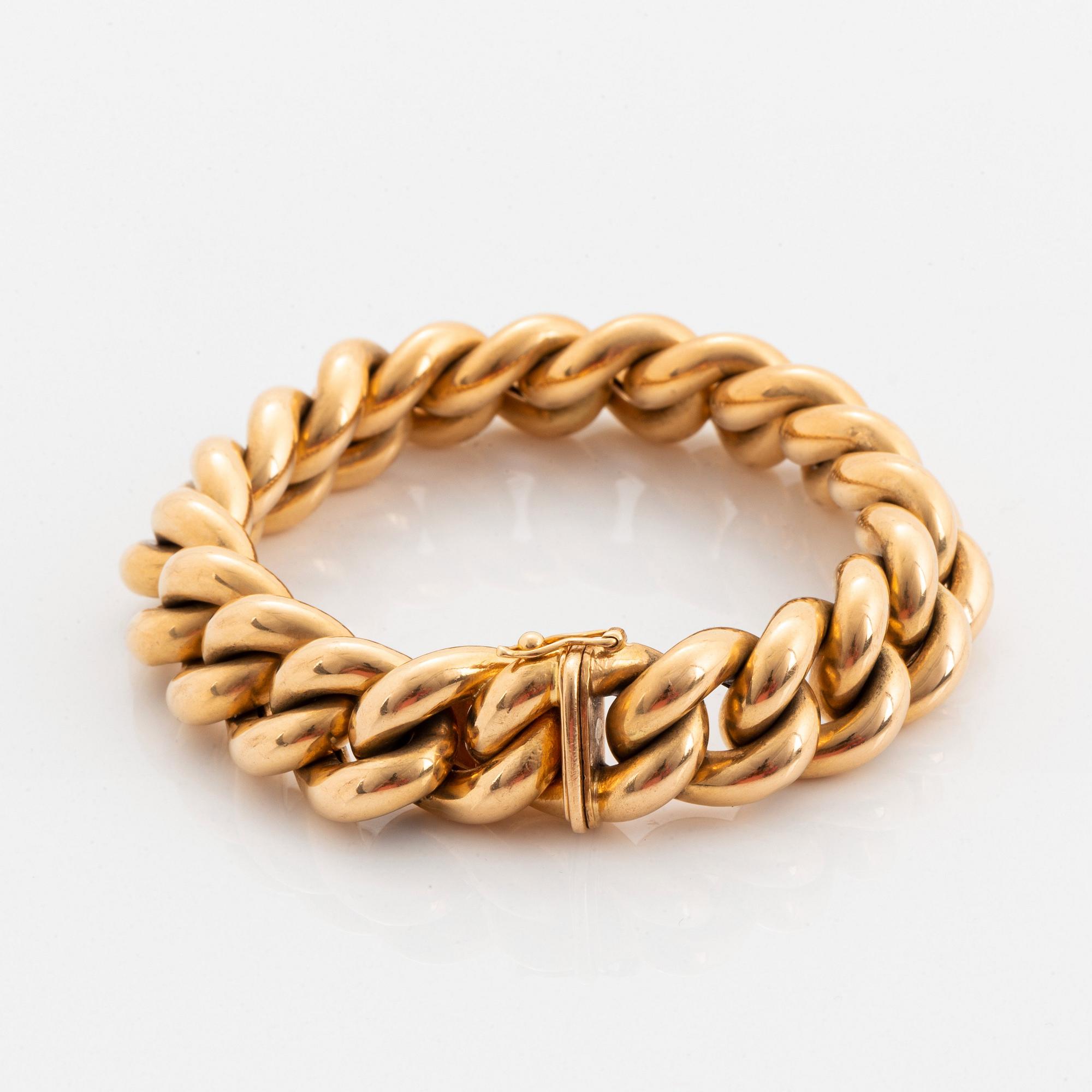 An 18K gold bracelet.