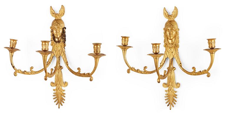 A pair of Russian Empire early 19th century gilt bronze three-light wall-lights.